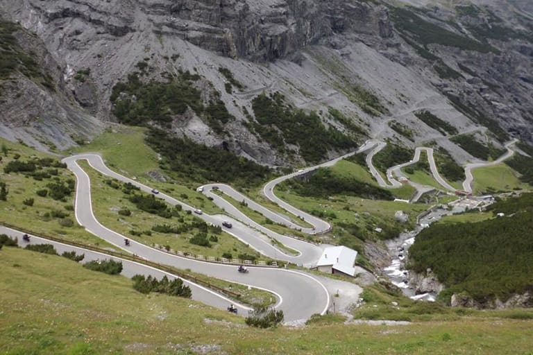 The narrow, wooded Mortirolo road climbing above the Valtellina.